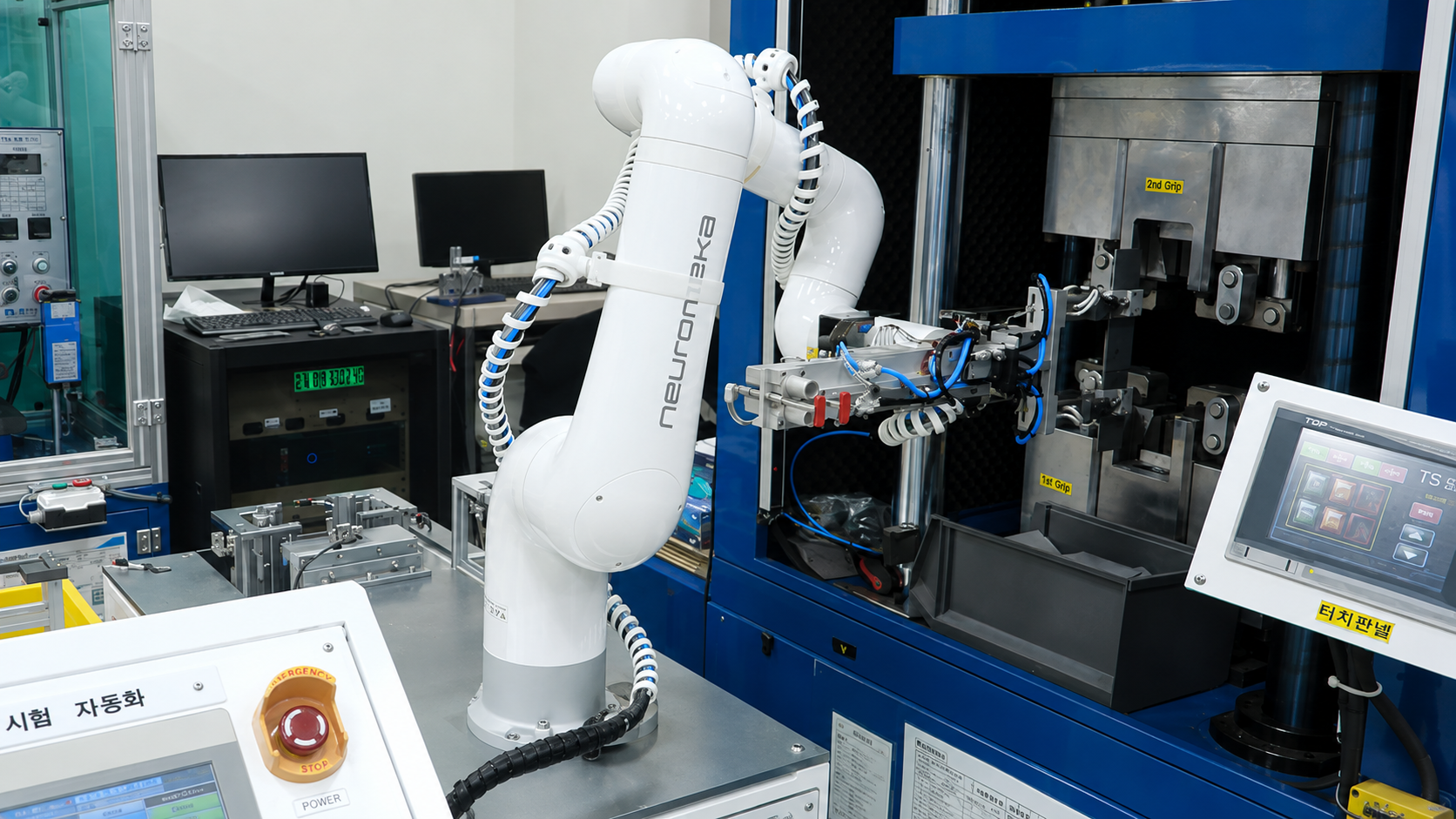 Indy collaborative robot loading a workpiece into a tensile testing machine
